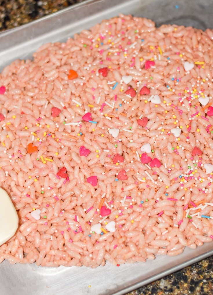 Line the baking tray and spread the mix on the tray